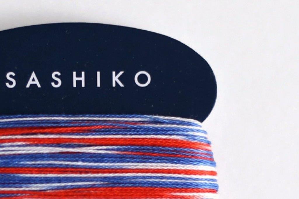 Close-up of red, white and blue Daruma regular sashiko thread