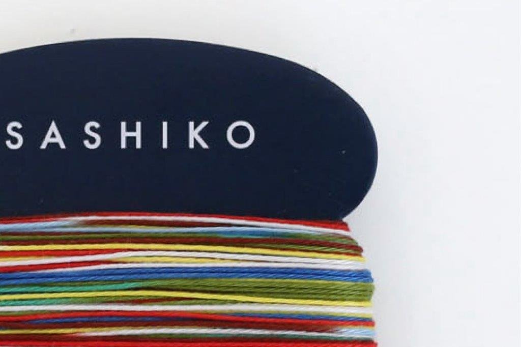 Multicoloured Daruma regular sashiko thread on a card
