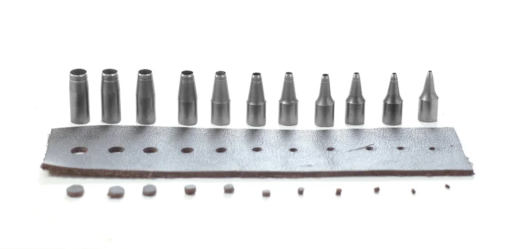 Eleven Nonaka blades above a strip showing holes in different diameters