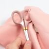 Cohana Sakura 2026 small scissors held in a hand to show their size