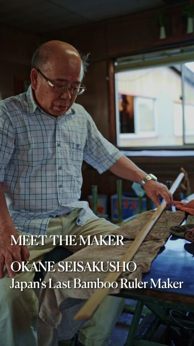 An Okane craftsperson at the bench, from Eight Needles’ maker-post cover.